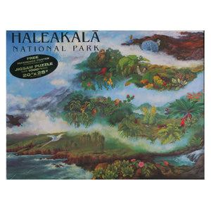 The puzzle box top illustration encompasses all of the diverse and complex ecosystems of the great volcano Haleakalā on Maui, from sea to summit. Native and endemic birds, plants, insects and stream animals are depicted tucked into their correct habitats, starting with the shoreline and ending at the high, dry and cold summit.