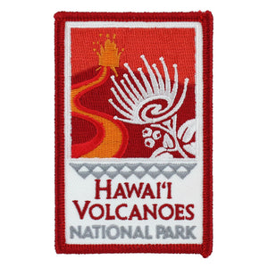 Red, orange and white patch, rectangular, depicting a Kīlauea fire fountain, lava flow, ʻohiʻa lehua blossom, and the title of Hawaiʻi Volcanoes National Park in Hawai‘i.