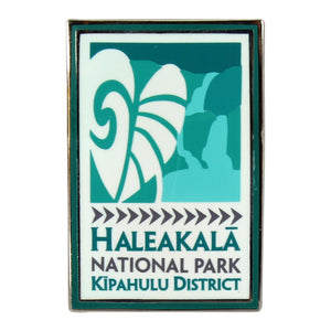 Colorful rectangular pin done in a sleek modern style and depicting the waterfalls at Kīpahulu in Haleakalā National Park on Maui in Hawai‘i. Green and white pin is enameled and measures 1.75” by .75”